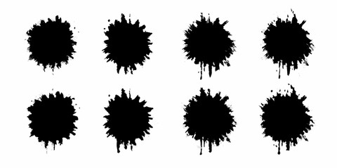 Collection of eight black ink splatters and drops on a white background
