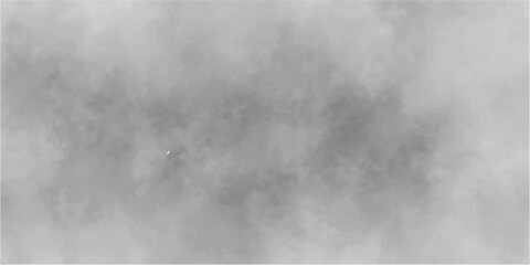 An abstract image of black and white smoke clouds on a dark sky	