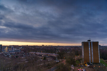 Obraz premium Breathtaking balcony view overlooking the lush green fields of Holland's countryside during a stormy summer sunset near Amsterdam, Netherlands