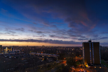 Obraz premium Breathtaking balcony view overlooking the lush green fields of Holland's countryside during a stormy summer sunset near Amsterdam, Netherlands