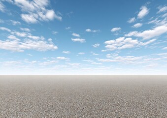 A vast, flat, pebble-strewn expanse meets a bright blue sky dotted with fluffy white clouds, evoking a sense of open space and tranquility