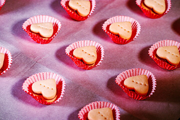 Heart cookies on red fabric