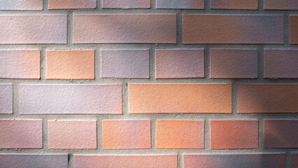 Wall of rectangular orange-coloured bricks