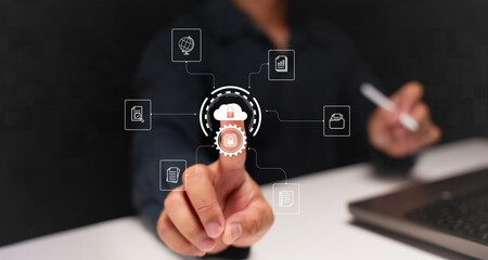 Fototapeta premium A person interacts with digital icons, symbolizing technology, data, and security, showcasing modern connectivity and engagement in a digital landscape.