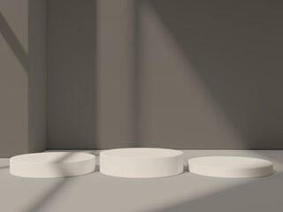 White podiums arranged in a modern minimalistic interior, creating a refined product display.