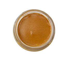 Tasty mustard sauce in glass jar isolated on white, top view