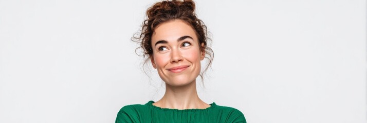Cheerful young Caucasian woman in green, pondering thoughts of serendipity, World Smile Day, introspective joyfulness unveiled
