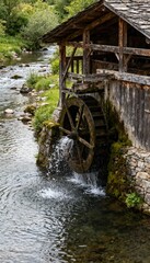 Obraz premium Rustic watermill turning beside a tranquil river