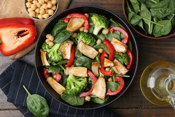 Tasty salad with eryngium mushrooms served on wooden table, flat lay