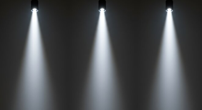 Tr&ecirc;s pontos de luz direcionais de cima para baixo, raios de luz em fundo cinza, est&uacute;dio cinza iluminado para apresenta&ccedil;&atilde;o.