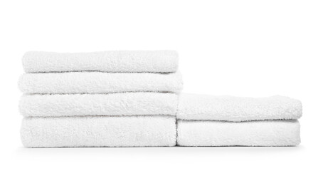 Stacks of folded terry towels isolated on white