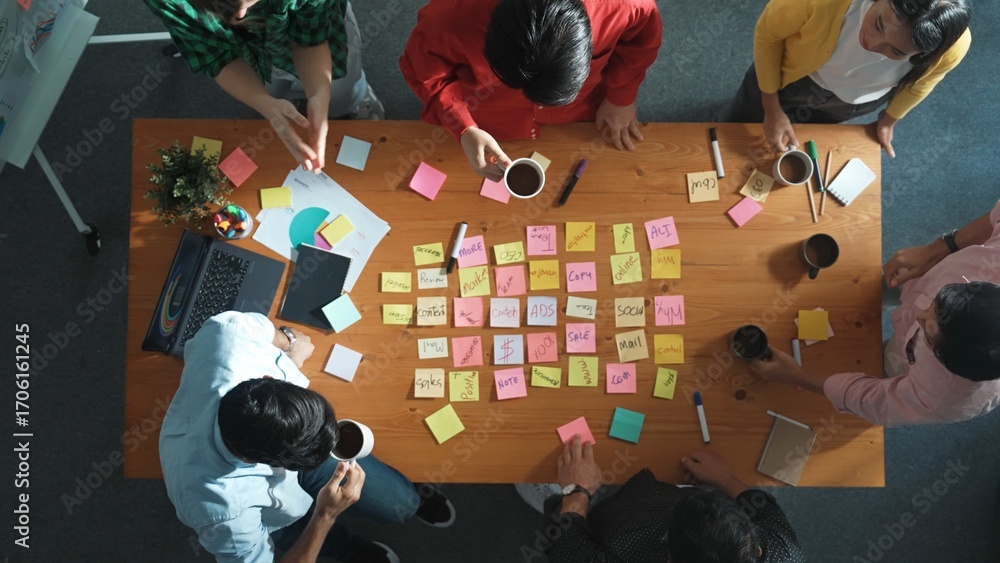 Poster top view of diverse business team putting hand together and clapping hand while brainstorming market