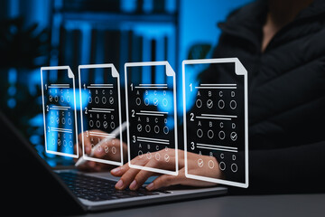 Online exam and digital assessment concept, student using laptop with virtual multiple-choice answer sheets represent e-learning, online testing, remote education, academic evaluation, learning tools