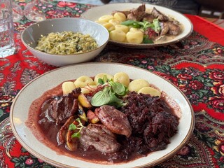 Ukrainian restaurant with various traditional dishes on a red table cloth