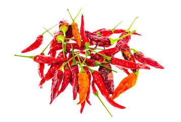 pile of different types of chili peppers on white background