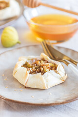 Fig Galette on Ceramic Plate with Fresh Figs and Rustic Background