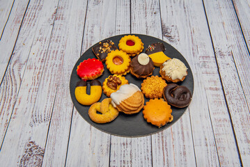 French tea pastries with pastel-colored macarons, almond financiers, and sugar-dusted shell-shaped madeleines