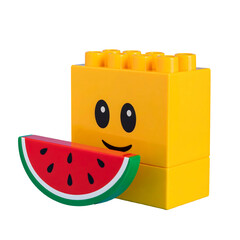Obraz premium Smiling lego figure with watermelon slice