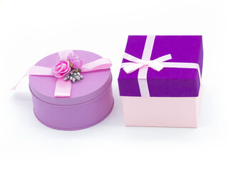 A purple box with a pink ribbon