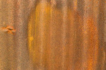 The image is of a rusty metal surface with a brown and yellow color