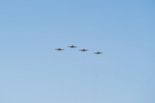 Formation flight of M-346 Bielik jets soaring gracefully in the clear blue sky during a vibrant training exercise over the horizon