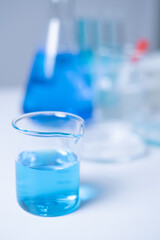 Close-up laboratory equipment test tube beaker dropper pipette science research biotechnology chemistry healthcare and medical vaccine development innovation DNA antibiotic clinic hospital flask