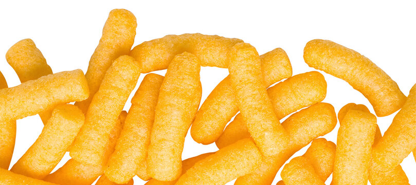 Crunchy cheese puffs falling on transparent background