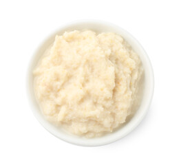 Tasty horseradish sauce in bowl isolated on white, top view