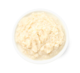 Tasty horseradish sauce in bowl isolated on white, top view