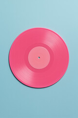 cd or dvd. compact disc isolated on blue background. Pink vinyl record on pastel light blue background.