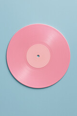 cd or dvd. compact disc isolated on blue background. Pink vinyl record on pastel light blue background.