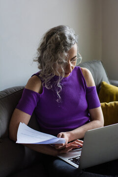 Woman making payments on home banking