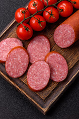 Sliced salami sausage, smoked dry meat as food background. Sliced salami