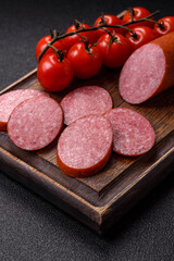 Sliced salami sausage, smoked dry meat as food background. Sliced salami
