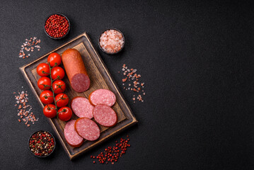 Sliced salami sausage, smoked dry meat as food background. Sliced salami