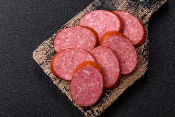 Sliced salami sausage, smoked dry meat as food background. Sliced salami