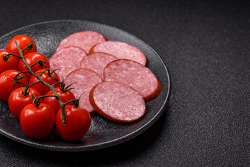 Sliced salami sausage, smoked dry meat as food background. Sliced salami