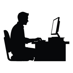 Silhouette of a person working on a computer at a desk silhouette