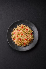 Asian food, chinese or thai rice noodles with vegetables and meat. Rice noodles