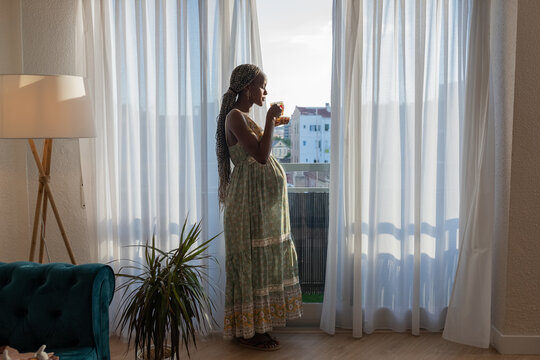 Pregnant woman drinking fresh herbal tea