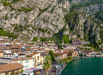 Limone sul Garda old town. Aerial view of panoramic Garda lake and Italian Alps mountains. Lombardy drone landscape of downtown