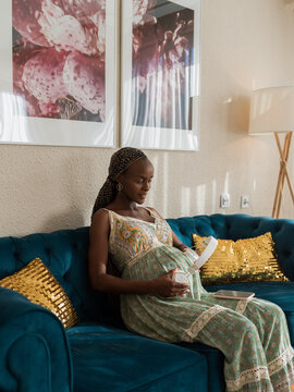 Woman playing music for her unborn baby