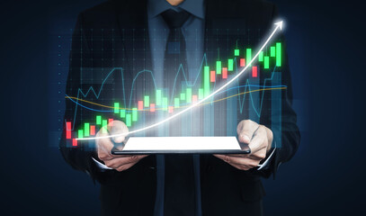 A businessman stands professionally, holding a tablet displaying a vibrant digital graph that highlights significant growth trends in business metrics and financial analysis. Impute