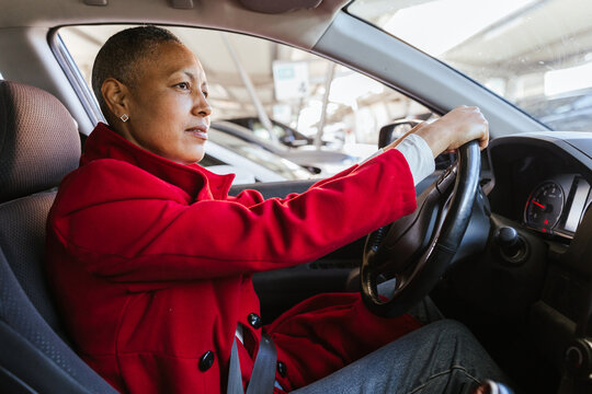 a woman maneuvering her car