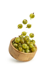 Gooseberry berries in a wooden plate isolated on a white background