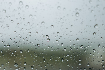 Drops of water on a car window during rain