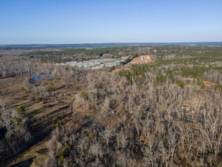 Aerial landscape suburban residence forest winter after Hurricane Helene Evans Augusta Georgia