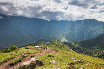 Panorama of caucasian Kazbegi mountains in Georgia. drama sky, mountain peaks, high resolution...
