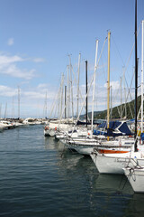 Yacht mooring in the harbor, yacht club harbor in Triet, Italy. Beautiful yachts against the blue sky