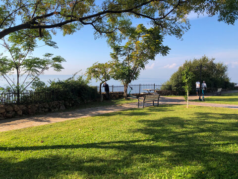 Scenic coastal cliffs in Antalya with a walking path overlooking the Mediterranean Sea, offering a peaceful and natural travel experience